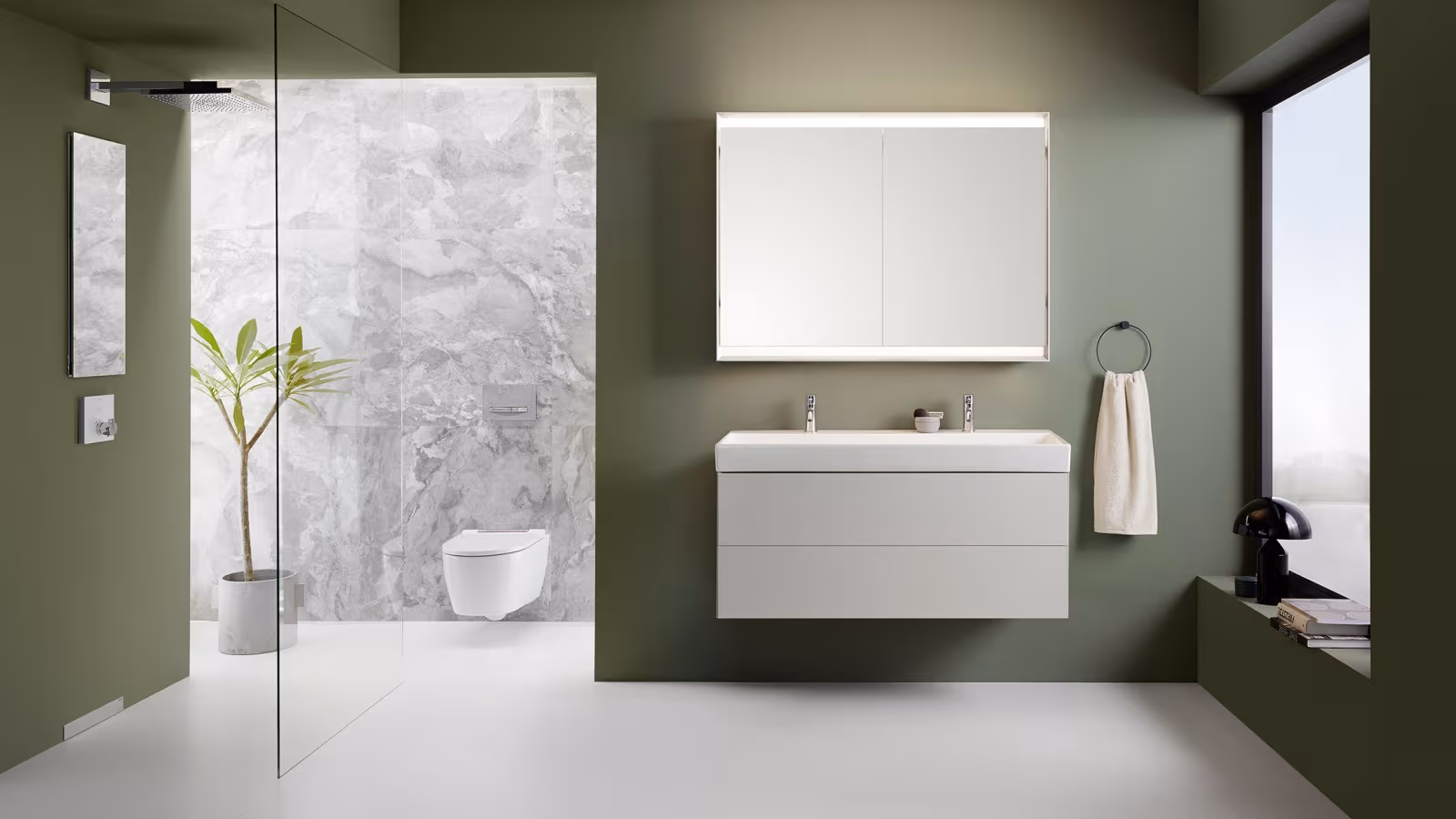 Green, spacious bathroom with Geberit in-wall systems Green, spacious bathroom with Geberit in-wall systems